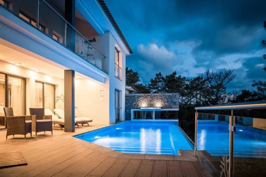 Heated infinity pool at sunset overlooking Faial Island and UNESCO vineyards