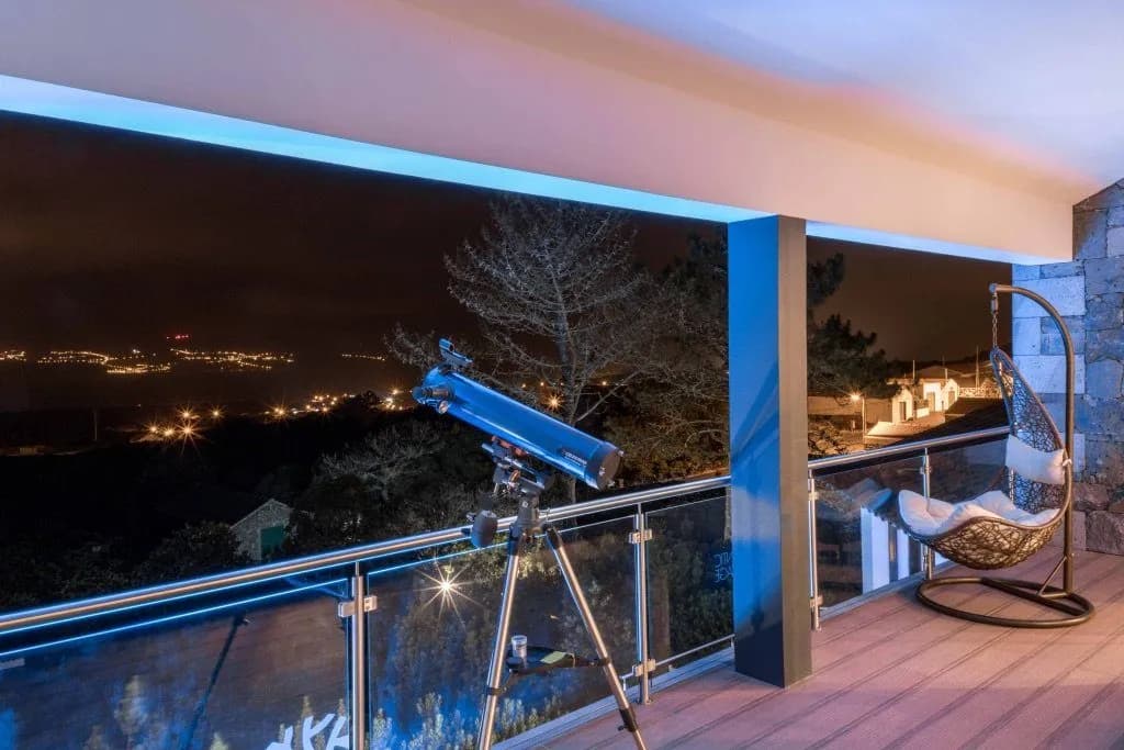 High-quality refractor telescope for stargazing on the upper balcony