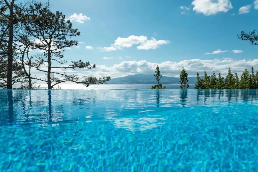 West-facing heated infinity pool overlooking the Atlantic channel between Pico and Faial islands